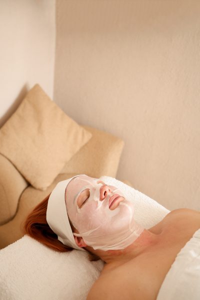 Mastering the First Impression: Your intriguing post title goes here Client relaxing with a hydrating sheet mask during a restorative facial treatment.