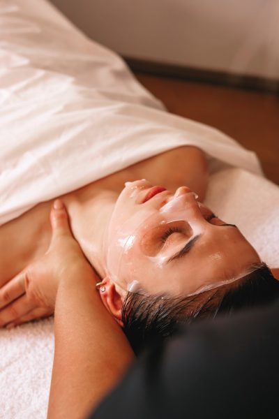 LED & Hydrating Facial Treatment Client enjoying a hydrating facial treatment with professional skincare products.