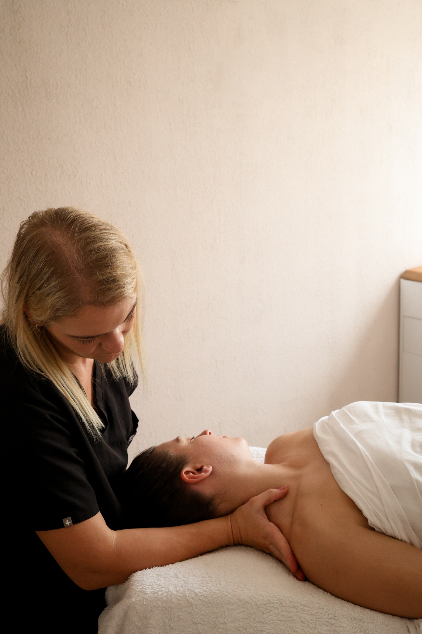 services-07 Relaxing neck and shoulder massage as part of a holistic facial treatment.