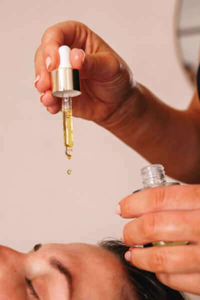 Professional Facial Serum Application Skin therapist applying professional facial serum during a personalised skin treatment.